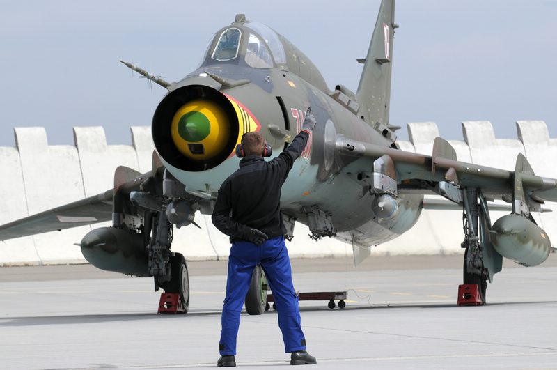 comp_RARO 13_18.jpg - A Polish Air Force ground crew member is checking the Su-22 at the flightline at Náměšt’before it will leave for another mission 